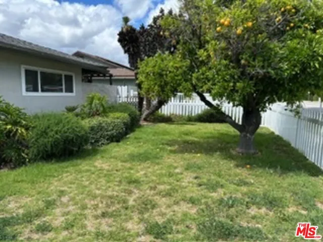 a view of backyard with green space