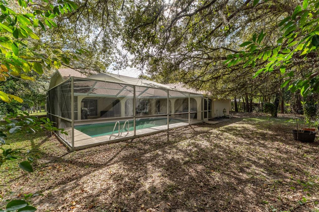 5142 South Louise Point Homosassa, FL 34446 - Photo 15 of 55 a view of house with backyard and trees