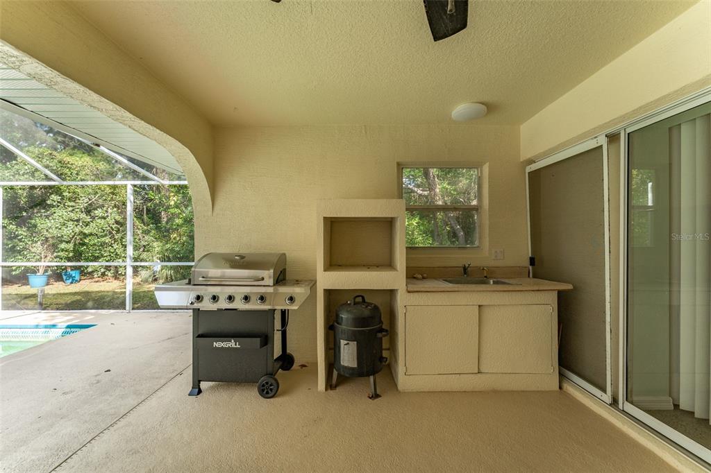 5142 South Louise Point Homosassa, FL 34446 - Photo 22 of 55 a kitchen with a stove a refrigerator and a fireplace