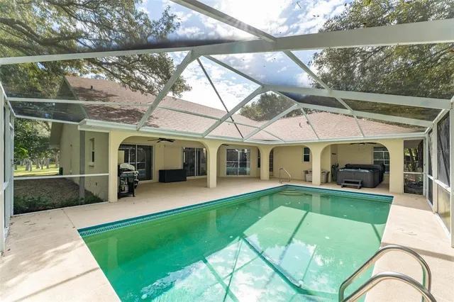 a bed room with a bed and a chandelier
