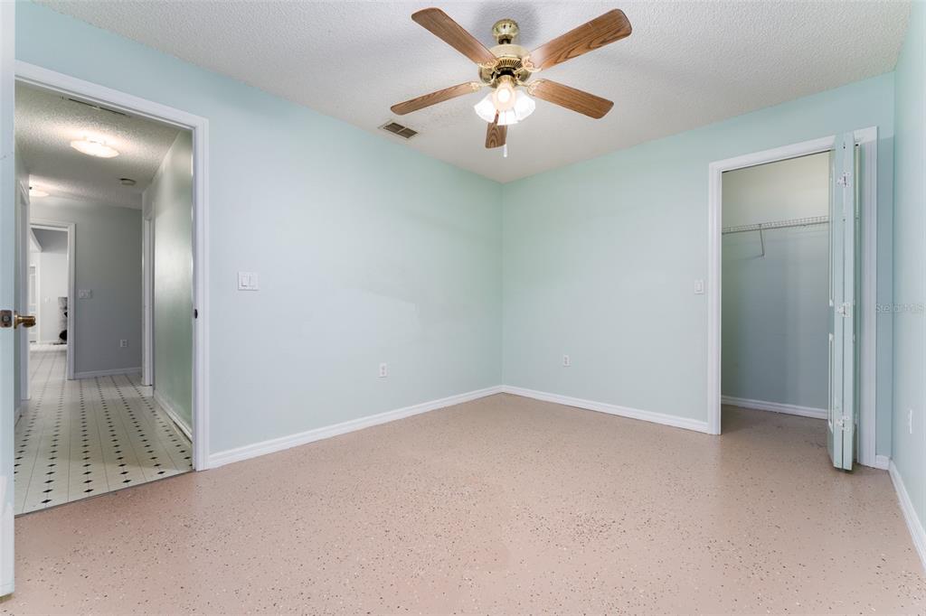 5142 South Louise Point Homosassa, FL 34446 - Photo 37 of 55 an empty room with fan and hallway