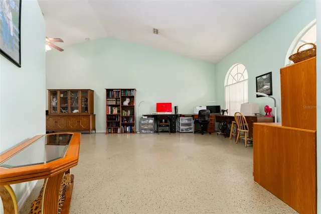 a dining room with a table and chairs