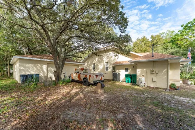 front view of a house with a tree
