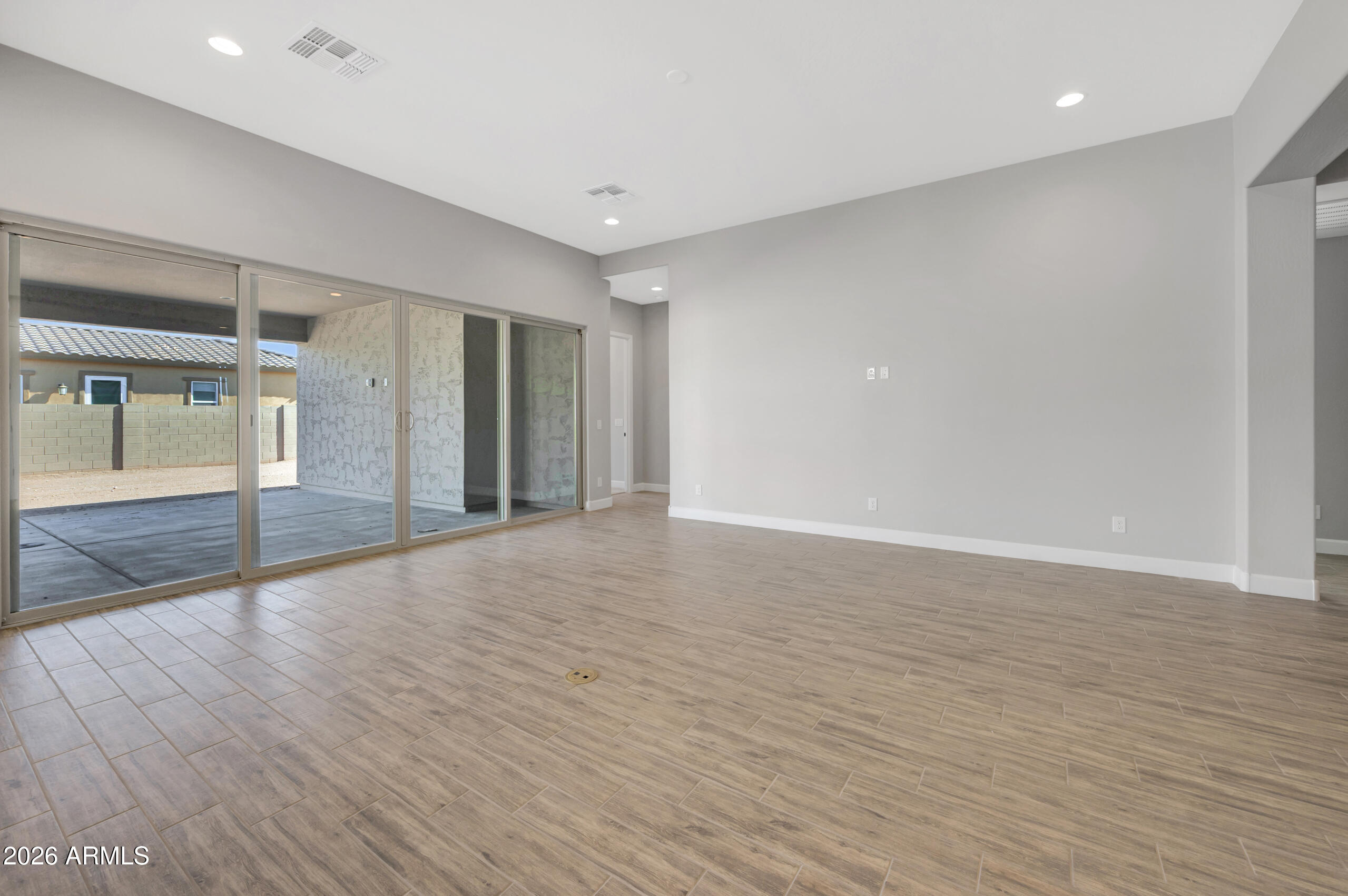 9809 Gold Stone Trail Apache Junction, AZ 85120 - Photo 3 of 23 a view of an empty room with wooden floor