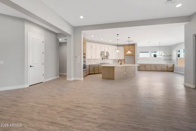 a view of a kitchen with a sink and cabinets