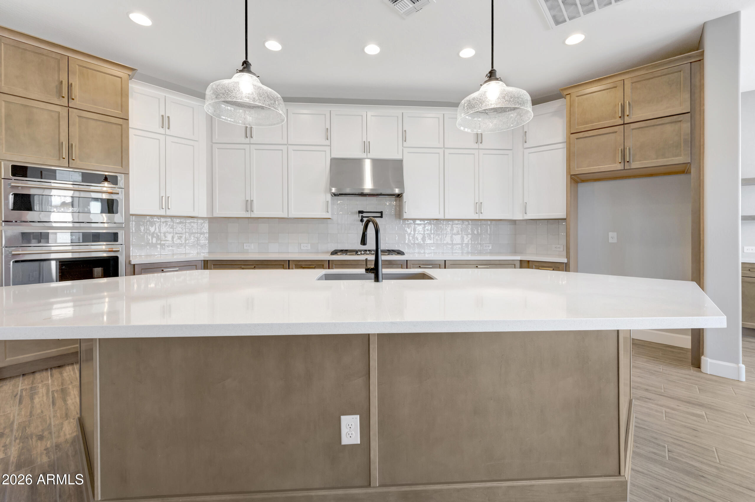 9809 Gold Stone Trail Apache Junction, AZ 85120 - Photo 6 of 23 a kitchen with kitchen island a sink stainless steel appliances and cabinets
