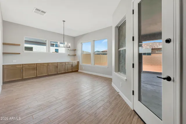 a view of an empty room and window