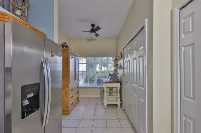 a kitchen with a sink cabinets and refrigerator