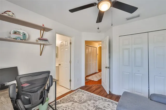 a view of room with window and furniture