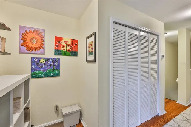 a view of a livingroom with furniture and staircase