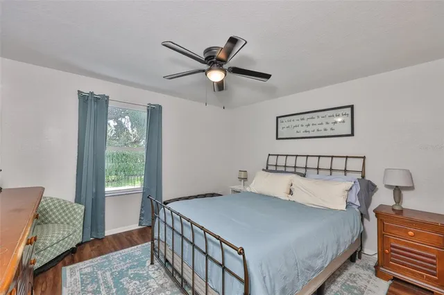 a bedroom with furniture and flat screen tv
