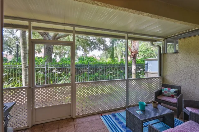 a view of deck with furniture and garden