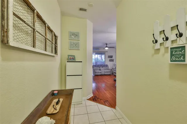 a view of a dining room with furniture wooden floor and chandelier