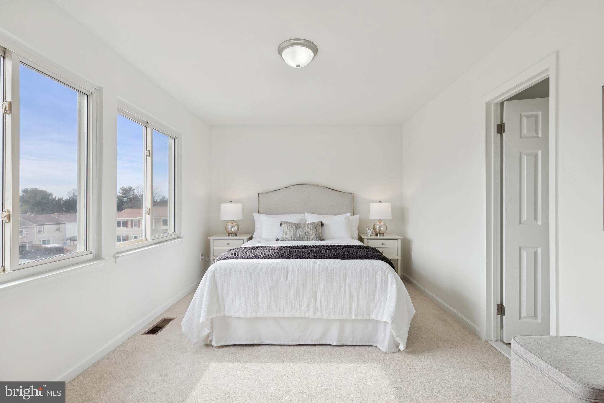 8737 Inquiry Court Walkersville, MD 21793 - Photo 23 of 56 a bedroom with a large bed and a window