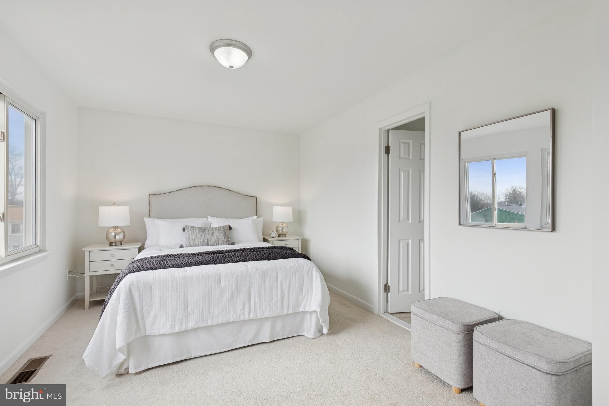8737 Inquiry Court Walkersville, MD 21793 - Photo 25 of 56 a bedroom with a bed and a painting on the wall