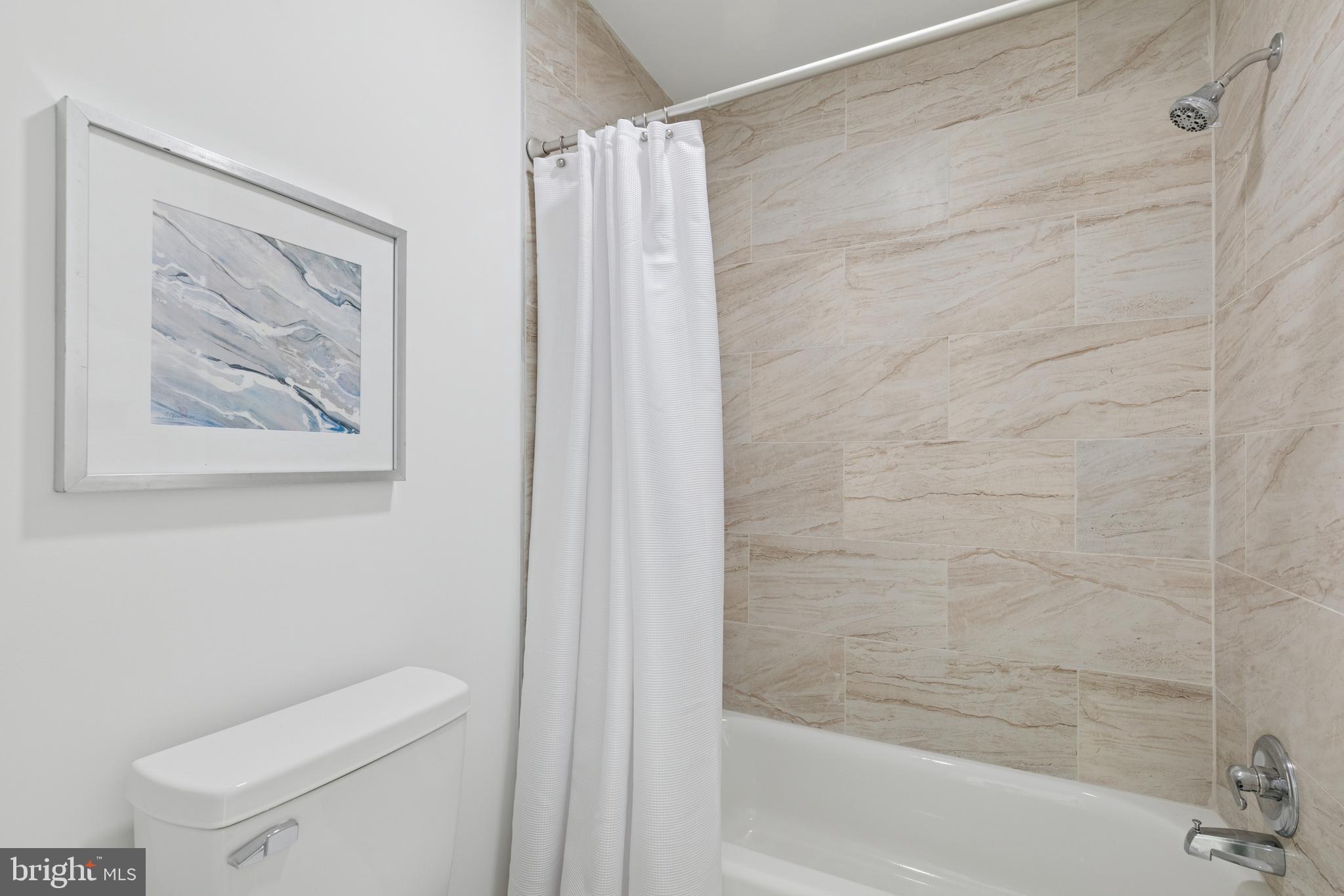 8737 Inquiry Court Walkersville, MD 21793 - Photo 37 of 56 a bathroom with a toilet and a shower