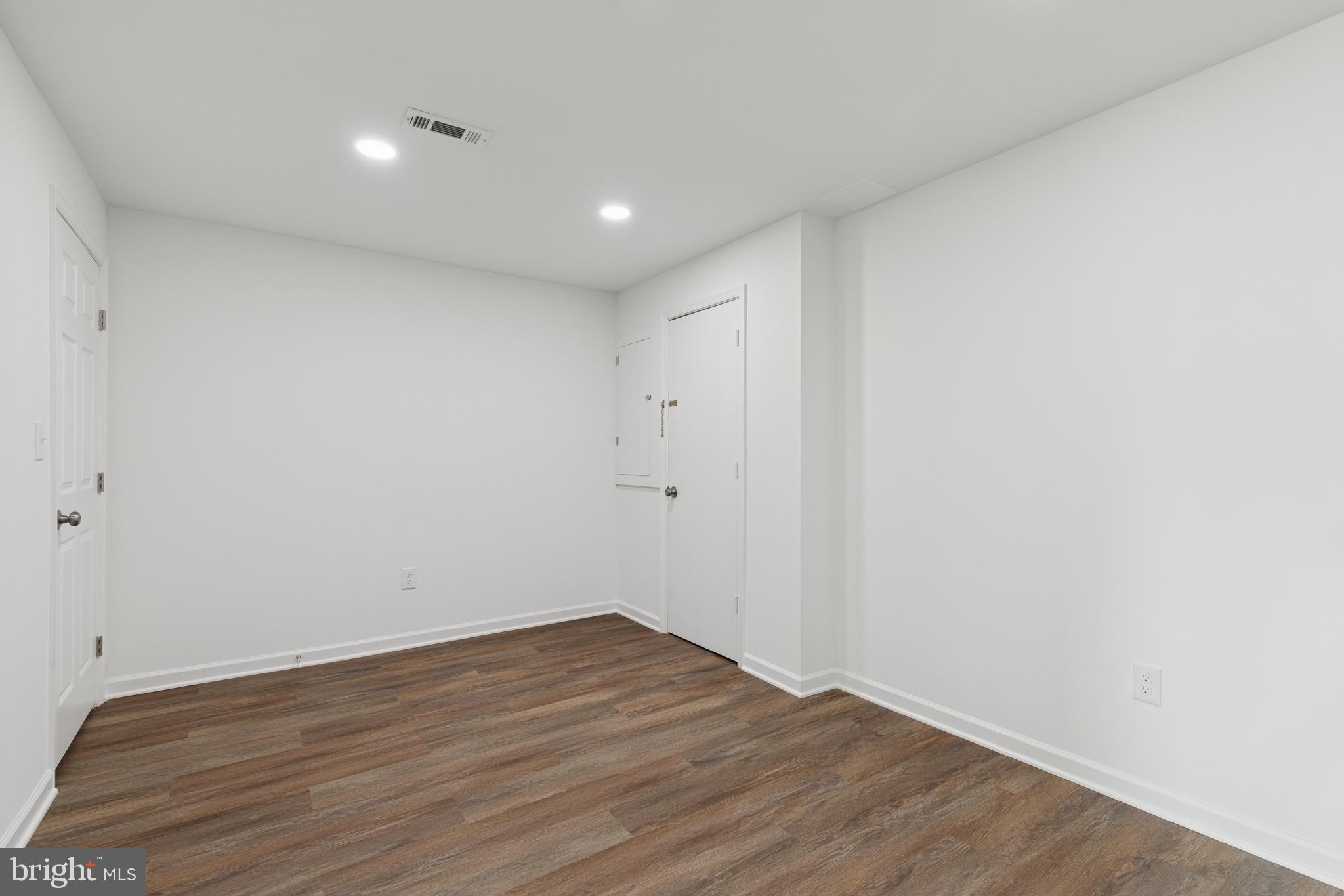 8737 Inquiry Court Walkersville, MD 21793 - Photo 40 of 56 a view of room with wooden floor and white walls