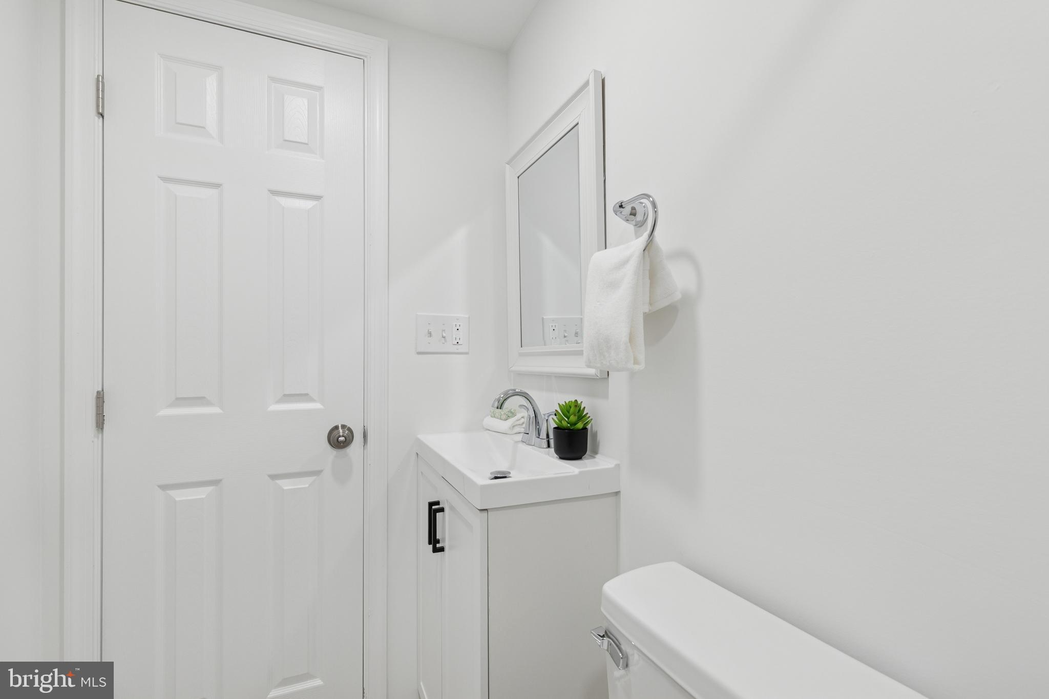 8737 Inquiry Court Walkersville, MD 21793 - Photo 42 of 56 a bathroom with a sink and toilet