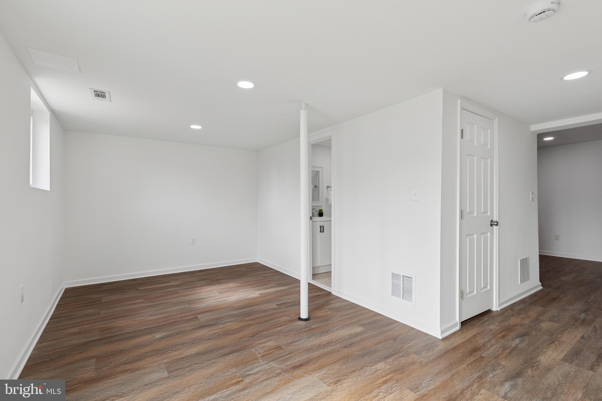 8737 Inquiry Court Walkersville, MD 21793 - Photo 46 of 56 a view of an empty room with wooden floor