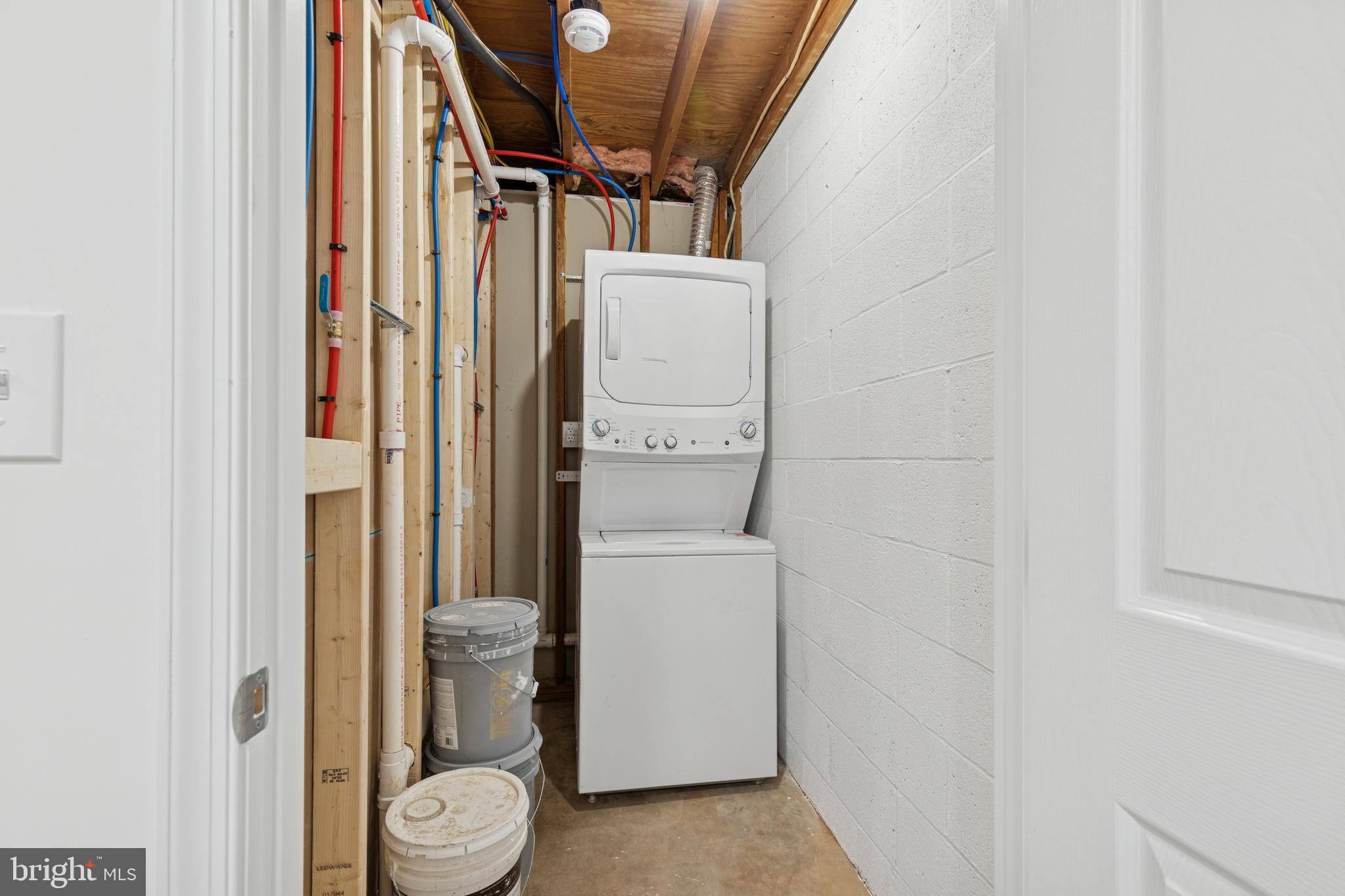 8737 Inquiry Court Walkersville, MD 21793 - Photo 49 of 56 a utility room with dryer and washer