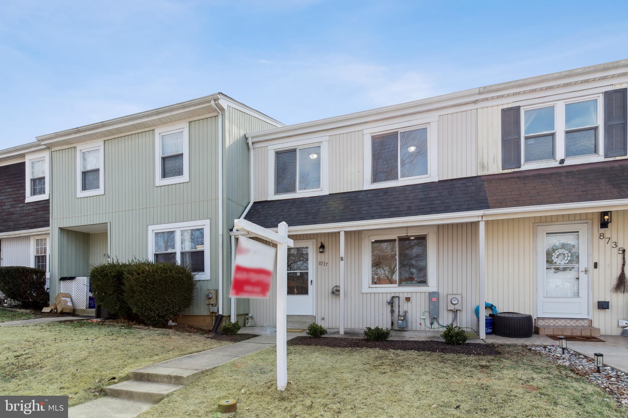 8737 Inquiry Court Walkersville, MD 21793 - Photo 5 of 56 a front view of a house with a yard