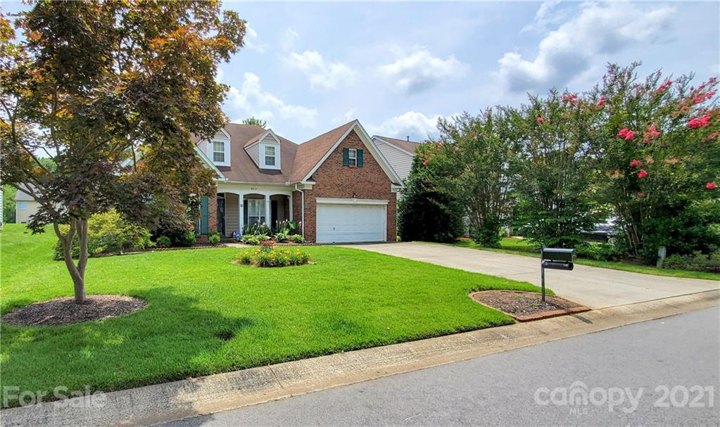6612 Reedy Creek Road Charlotte, NC 28215 - Photo 3 of 31 a front view of a house with a yard and green space