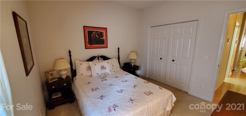 6612 Reedy Creek Road Charlotte, NC 28215 - Photo 22 of 31 a bed sitting in a bedroom next to a window