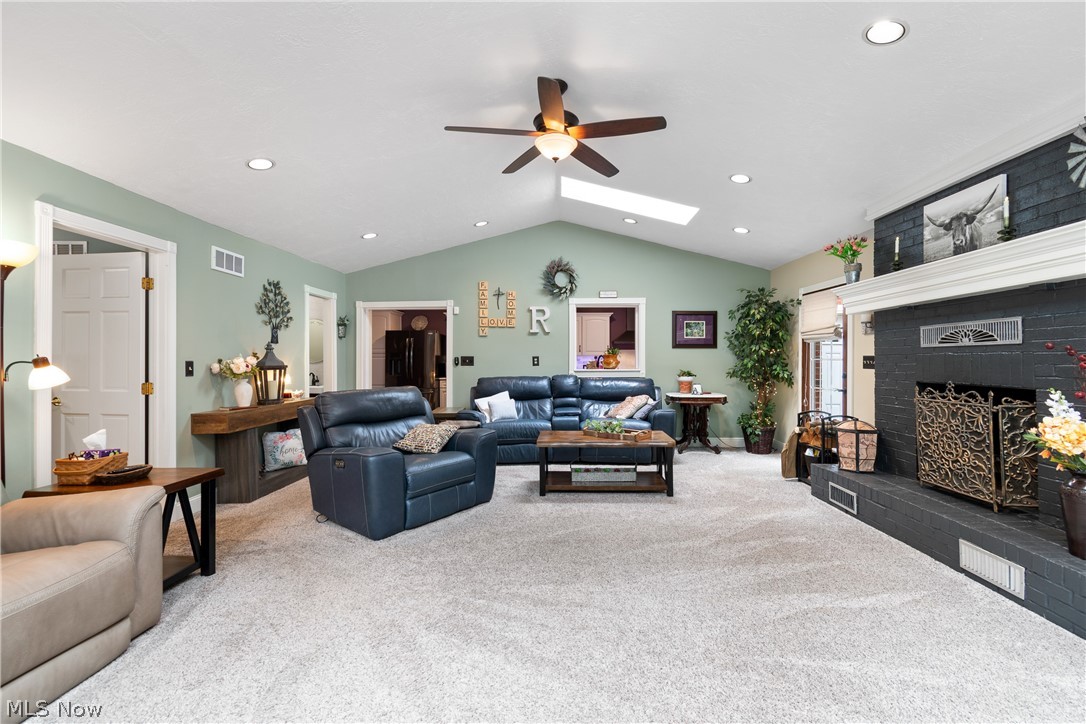 443 Merriman Road Akron, OH 44303 - Photo 13 of 44 Living room featuring vaulted ceilings, recessed lighting, and a skylight
