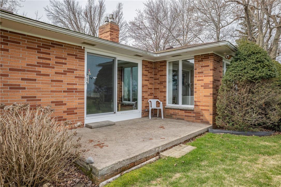 12 Lighthouse Road Parma, NY 14468 - Photo 38 of 49 New sliding glass door leads to this concrete patio.