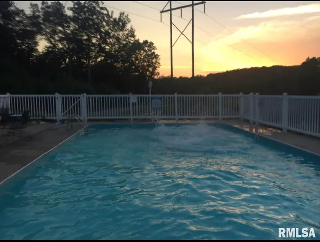 a view of a backyard with fence
