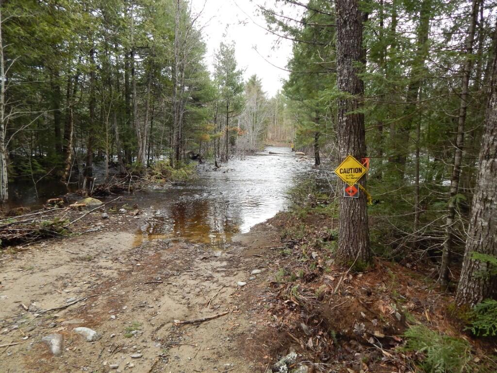 M5-l5 Call Road Milford, ME 04461 - Photo 8 of 51 Lot flood at swale before rocks on road