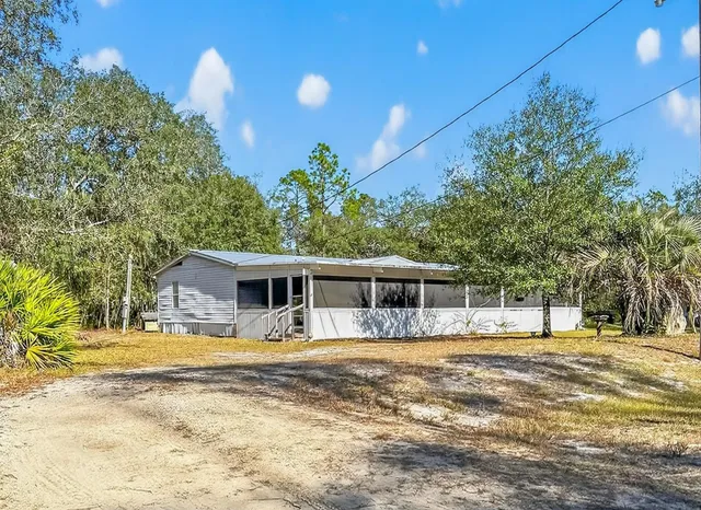 a view of a house with a swimming pool