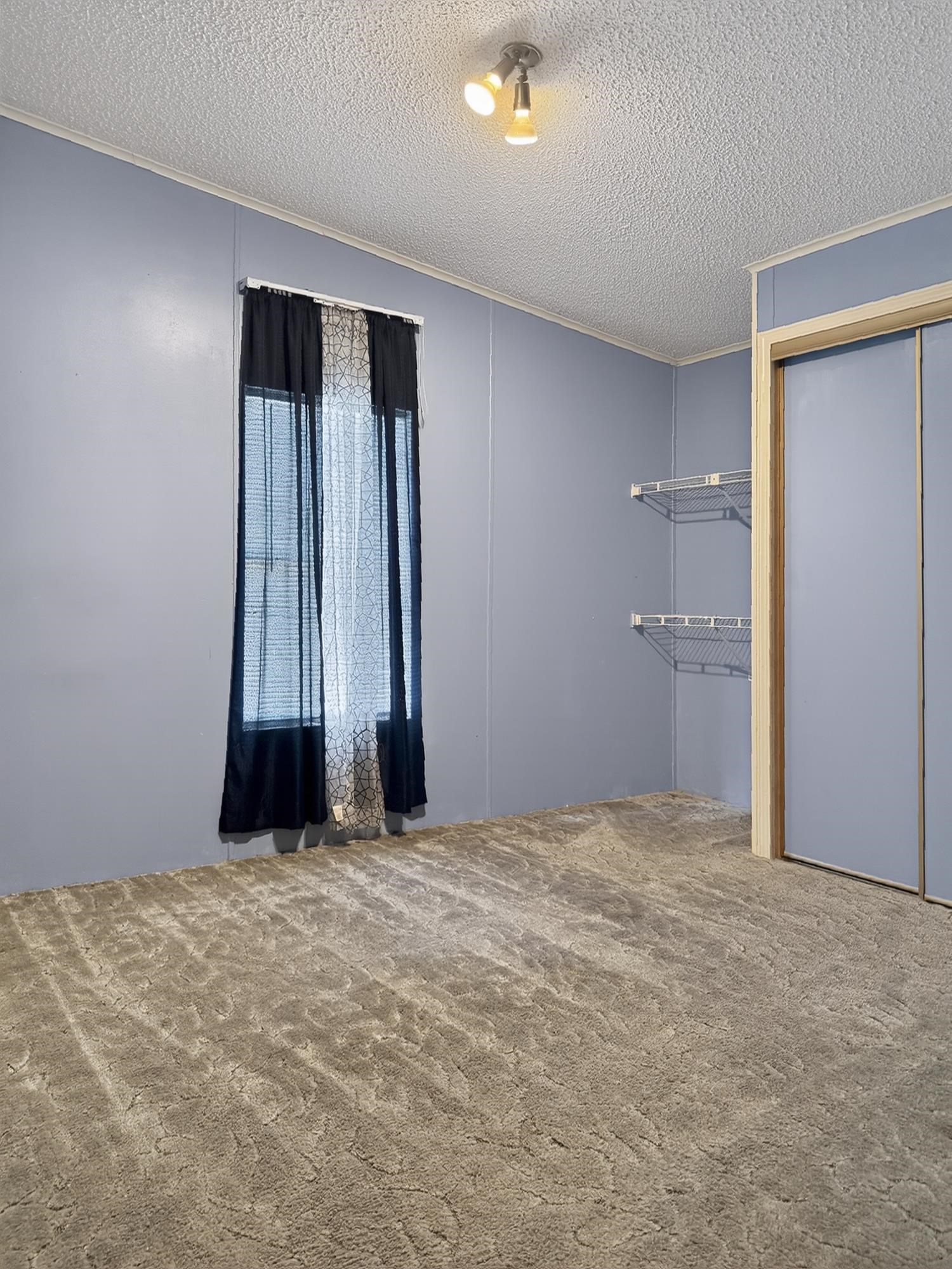 142 Garcia Street Interlachen, FL 32148 - Photo 14 of 28 a view of an empty room with a window