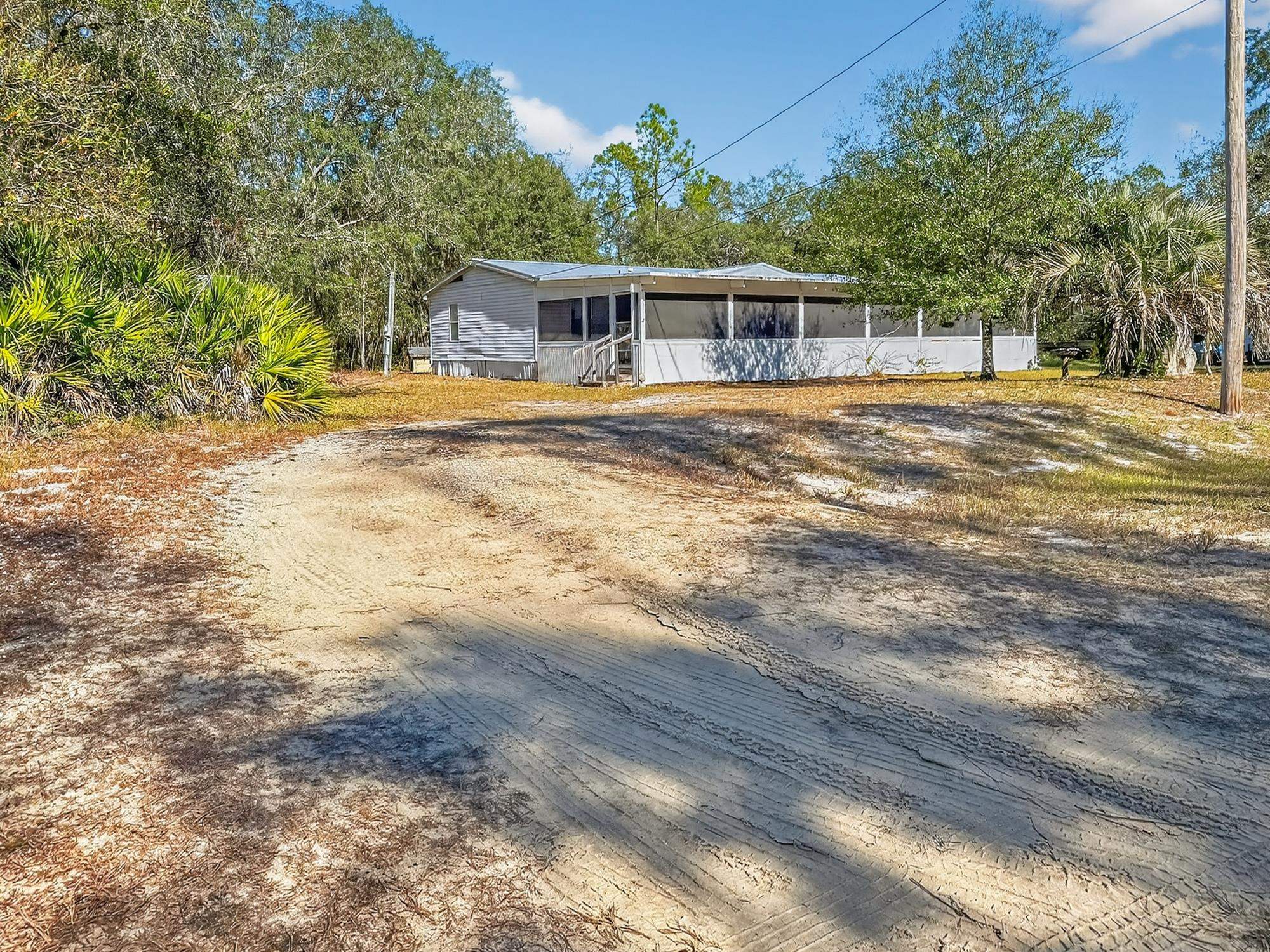 142 Garcia Street Interlachen, FL 32148 - Photo 2 of 28 a view of a house with a yard
