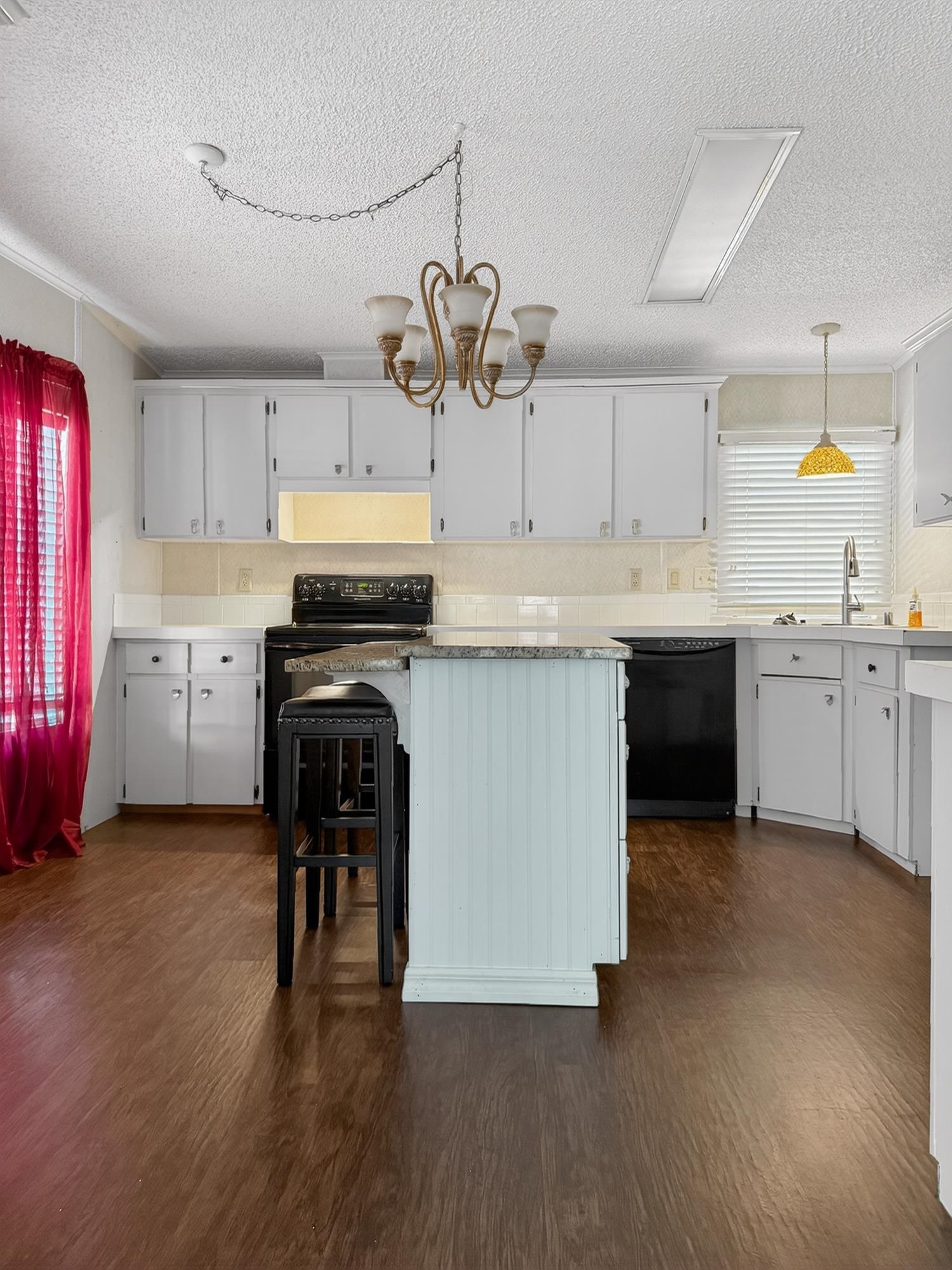 142 Garcia Street Interlachen, FL 32148 - Photo 22 of 28 a kitchen with cabinets a sink and appliances