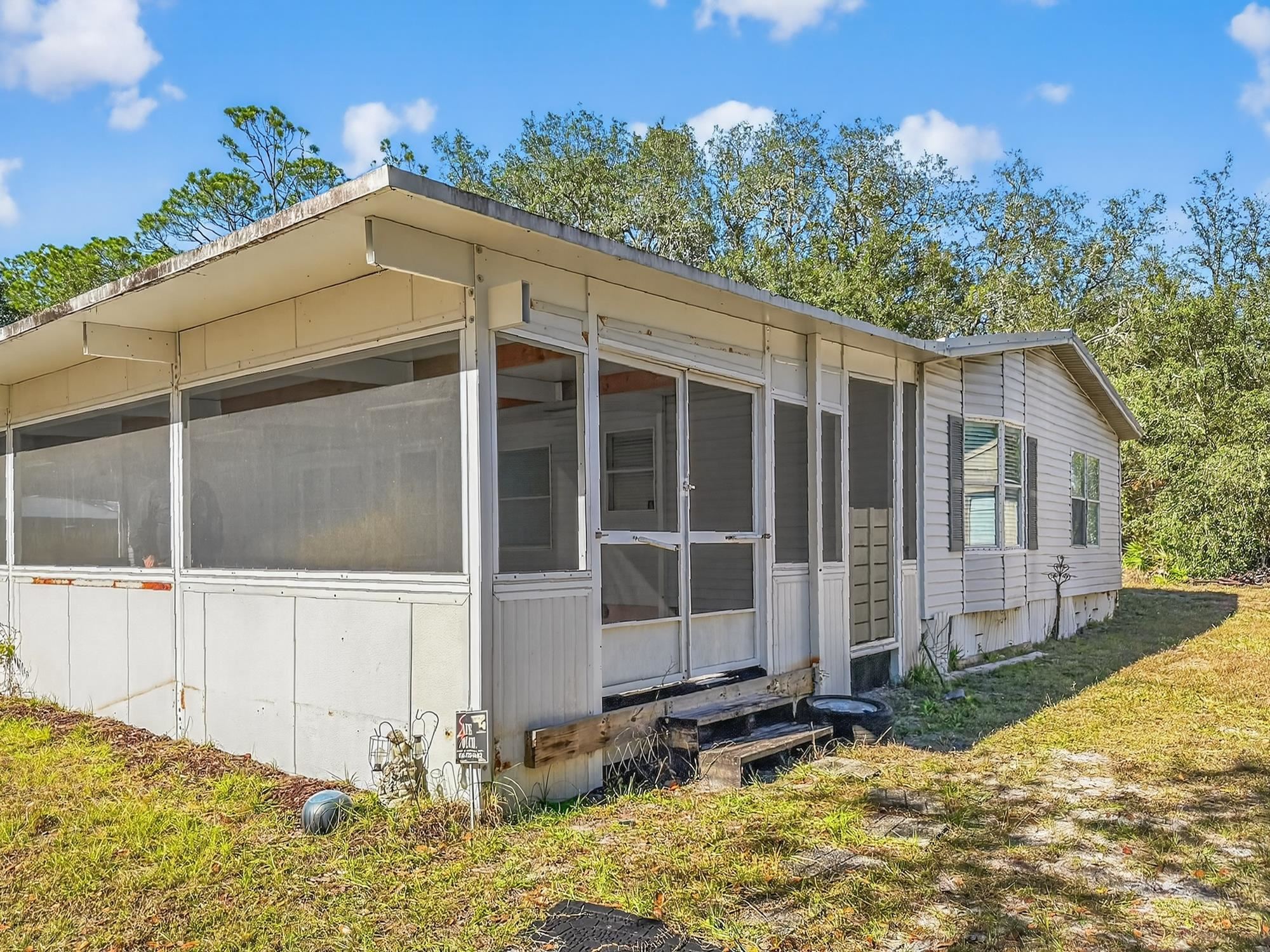 142 Garcia Street Interlachen, FL 32148 - Photo 27 of 28 a view of a house with a yard