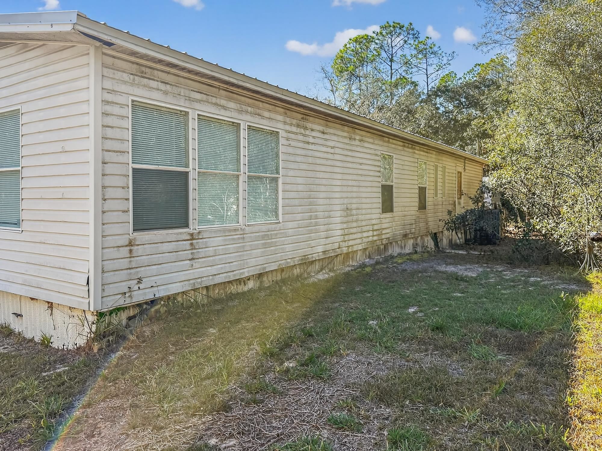 142 Garcia Street Interlachen, FL 32148 - Photo 28 of 28 a view of a house with a yard