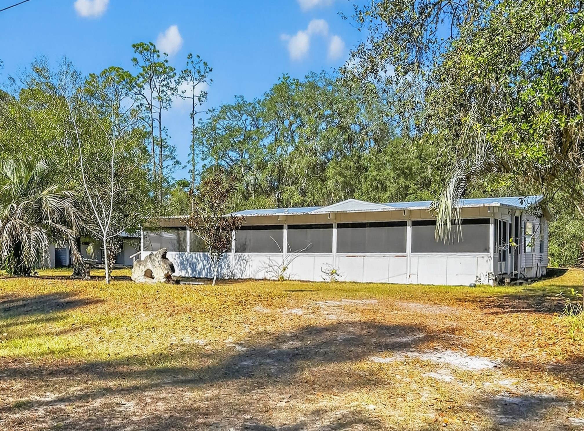142 Garcia Street Interlachen, FL 32148 - Photo 3 of 28 a view of a swimming pool with an outdoor seating