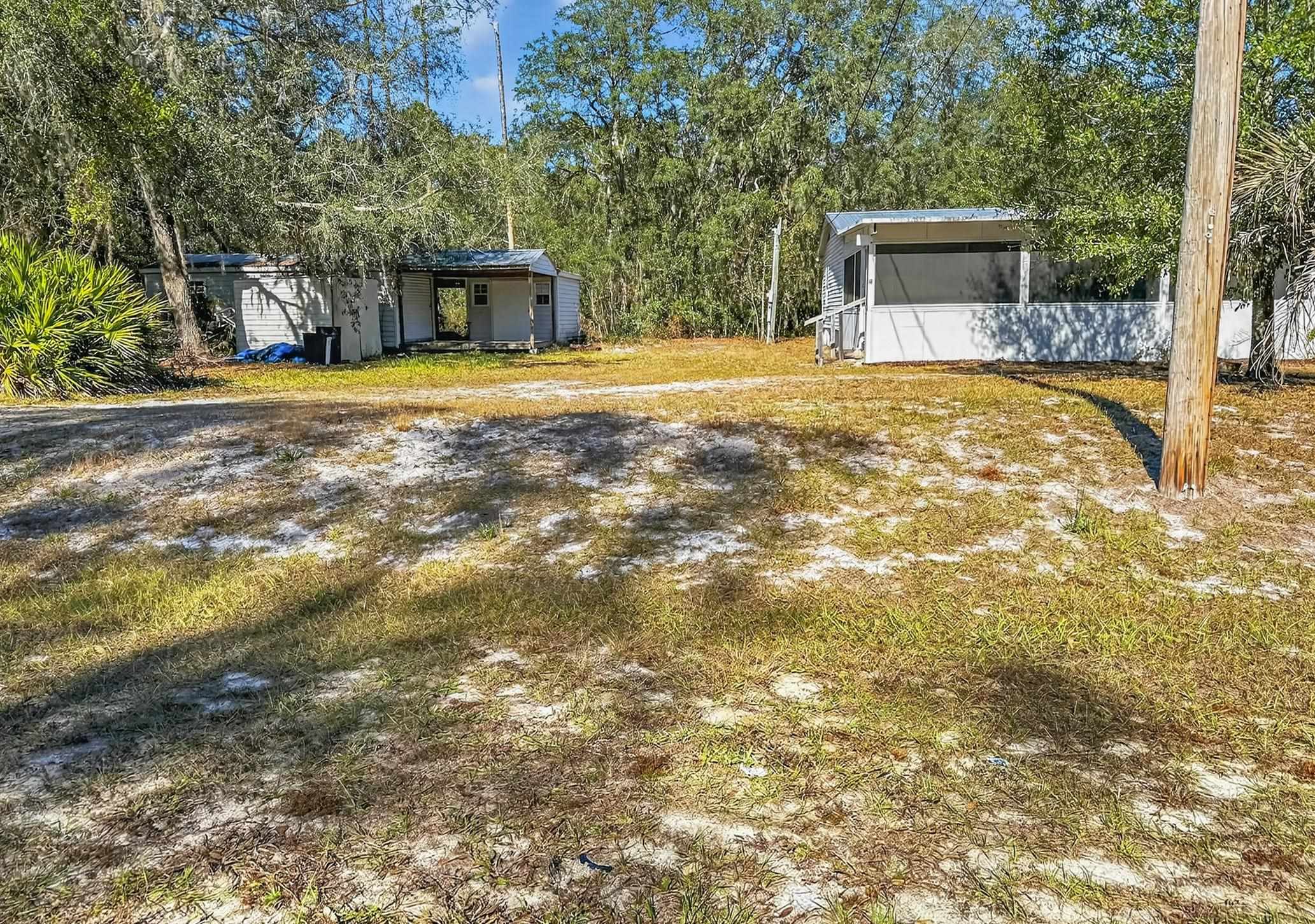 142 Garcia Street Interlachen, FL 32148 - Photo 4 of 28 a view of a house with a yard