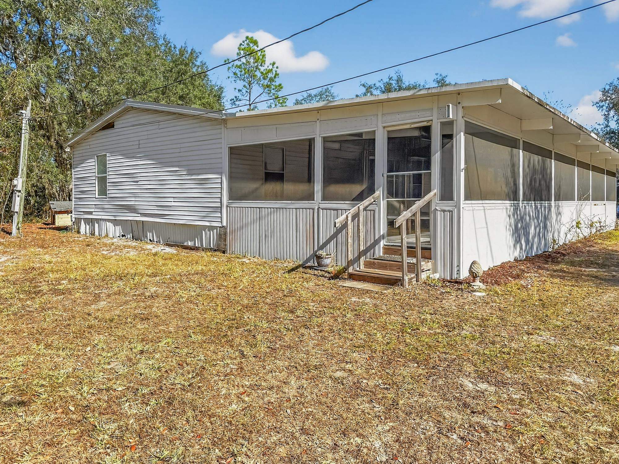 142 Garcia Street Interlachen, FL 32148 - Photo 6 of 28 a view of a house with a yard
