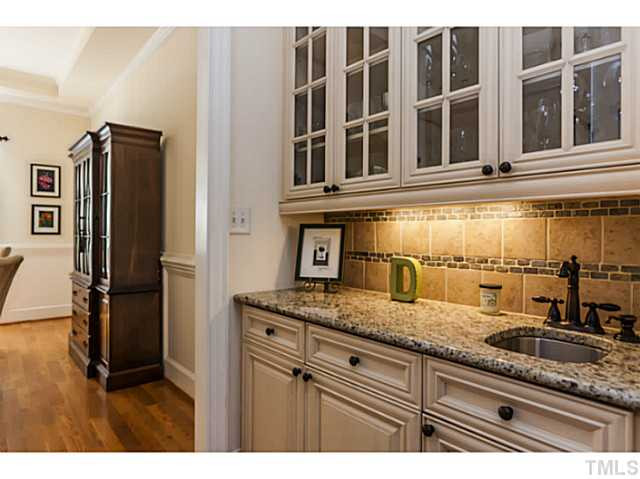 1101 Tacketts Pond Drive Raleigh, NC 27614 - Photo 6 of 25 a kitchen with granite countertop a sink and a refrigerator