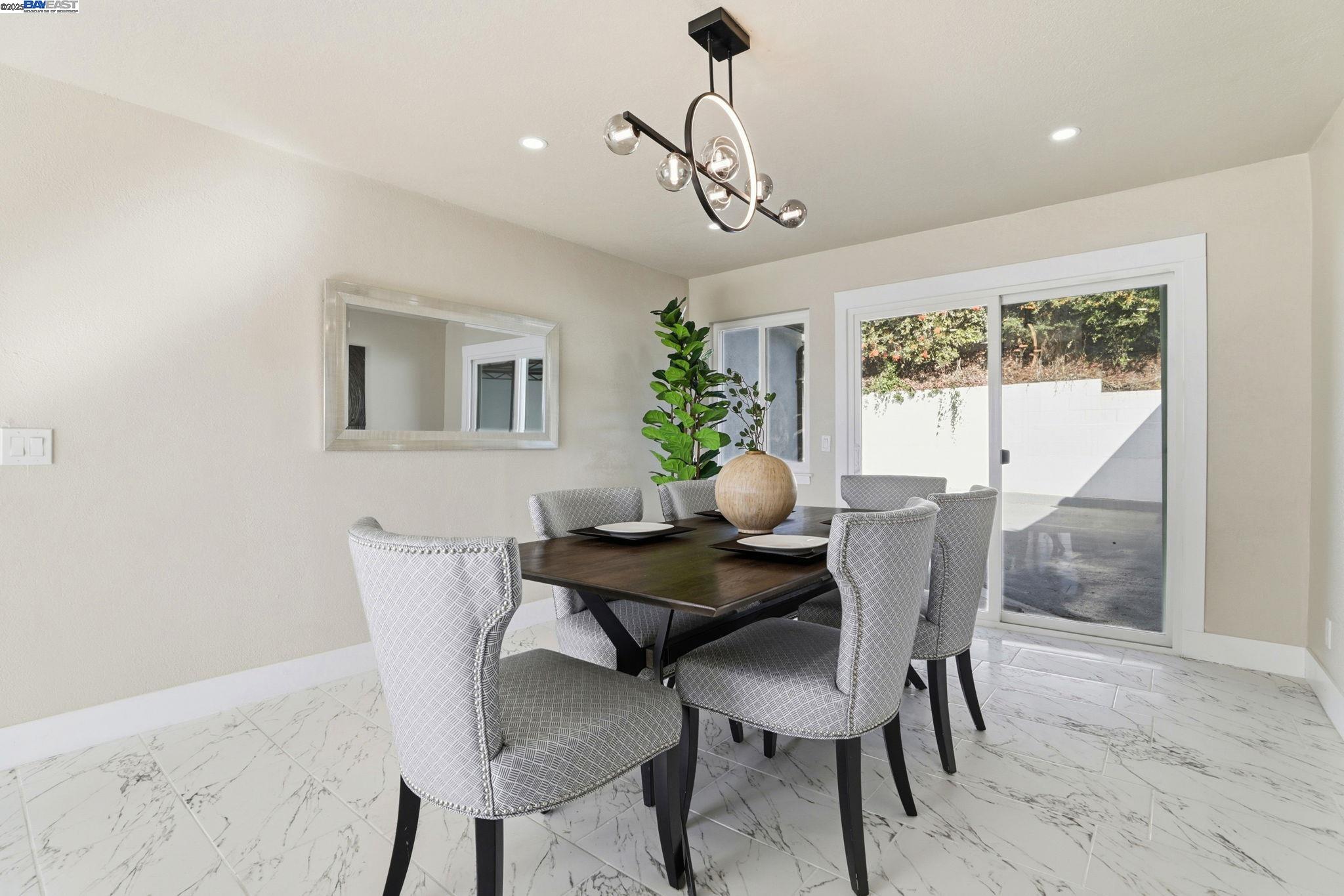10745 Ridgeview Way San Jose, CA 95127 - Photo 14 of 54 a view of a dining room with furniture window and wooden floor