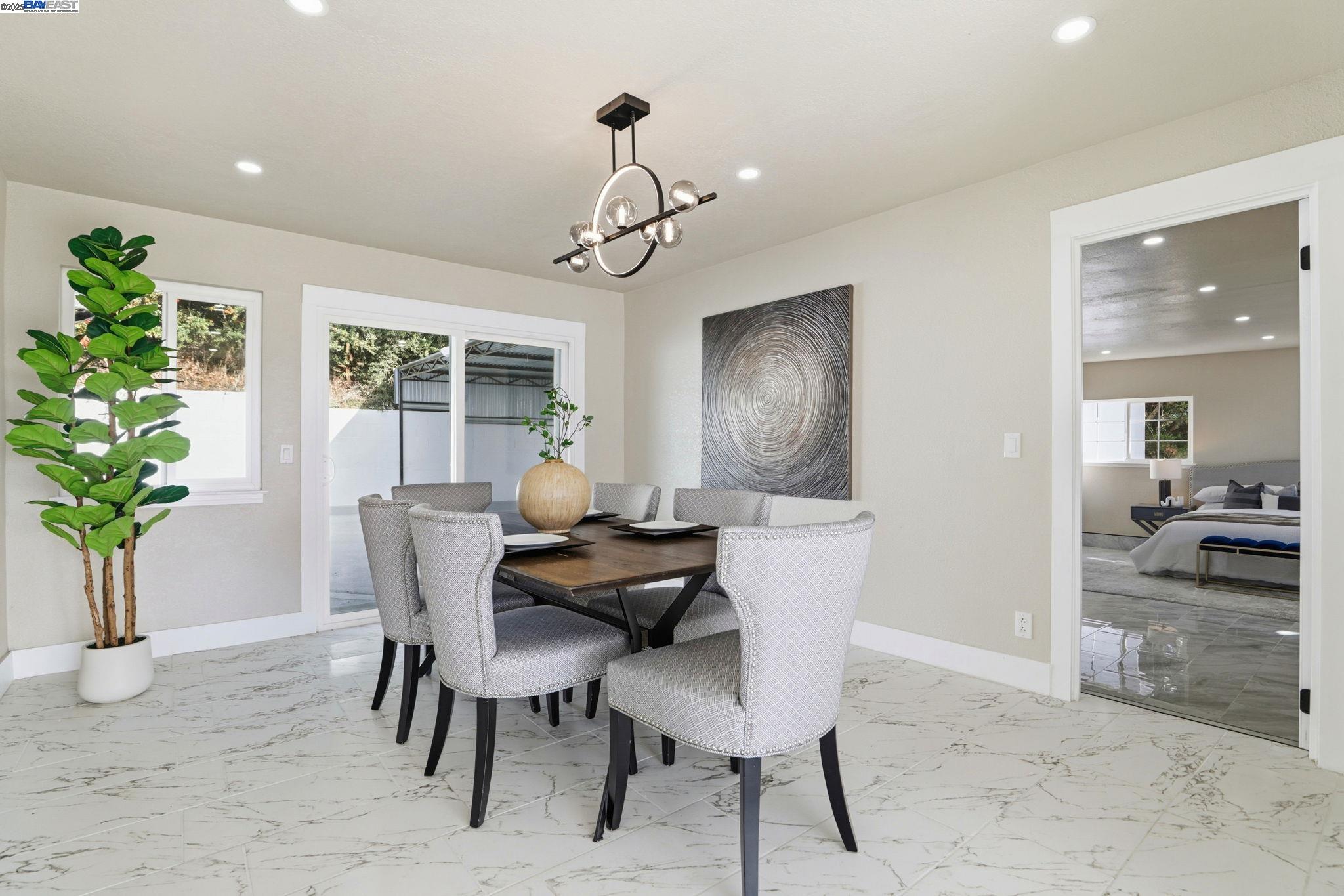 10745 Ridgeview Way San Jose, CA 95127 - Photo 15 of 54 a view of a dining room with furniture window and wooden floor