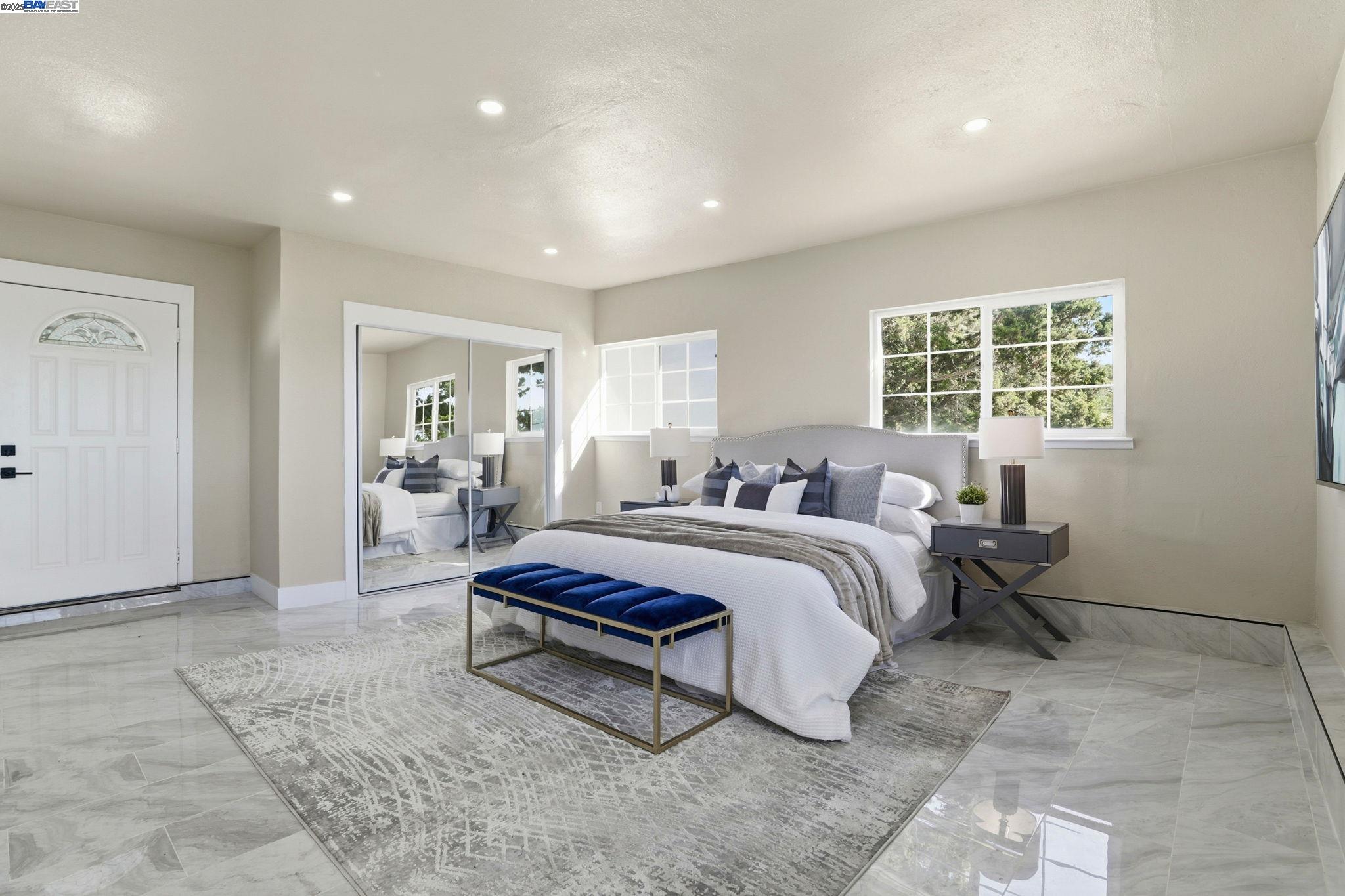10745 Ridgeview Way San Jose, CA 95127 - Photo 17 of 54 a spacious bedroom with a bed a table and a dresser