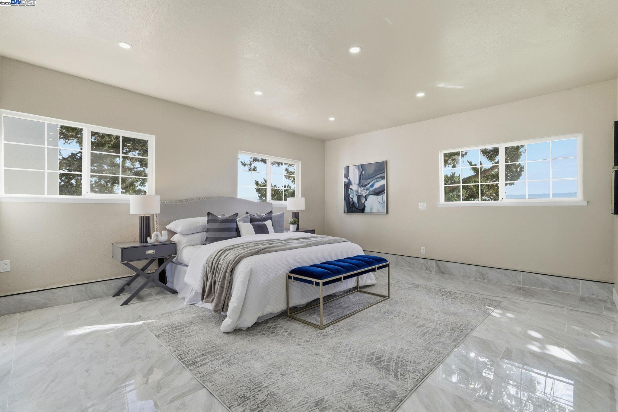 10745 Ridgeview Way San Jose, CA 95127 - Photo 18 of 54 a spacious bedroom with a bed and a window