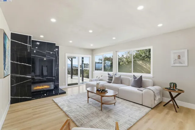 a living room with furniture and a rug