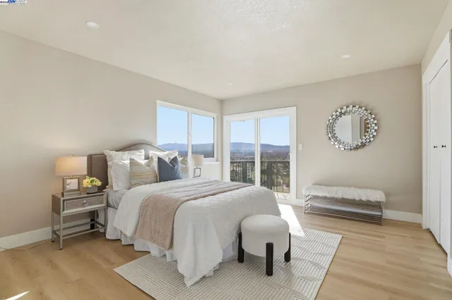a bathroom with a double vanity sink toilet mirror and shower