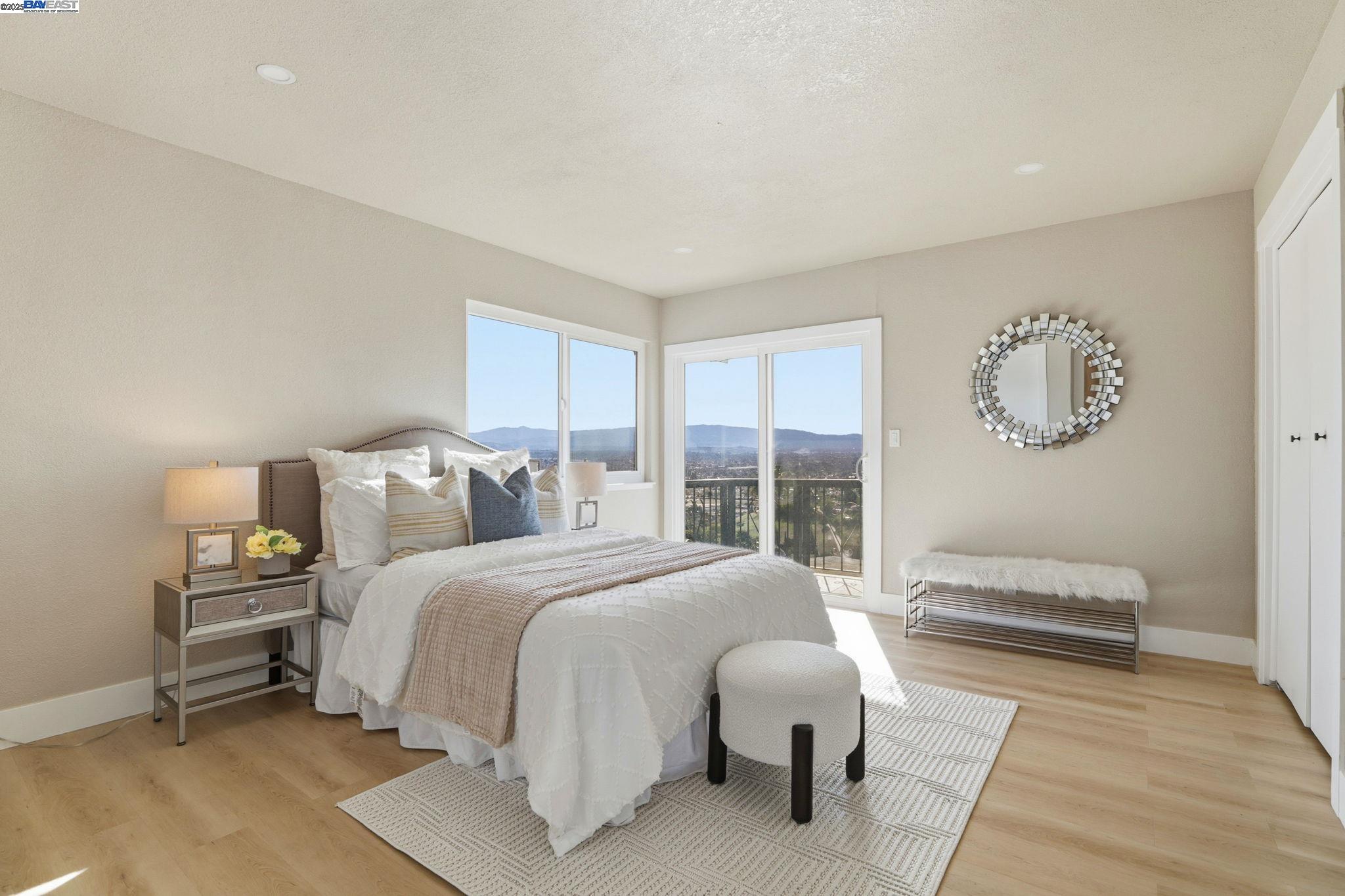 10745 Ridgeview Way San Jose, CA 95127 - Photo 23 of 54 a bedroom with a bed and a large window