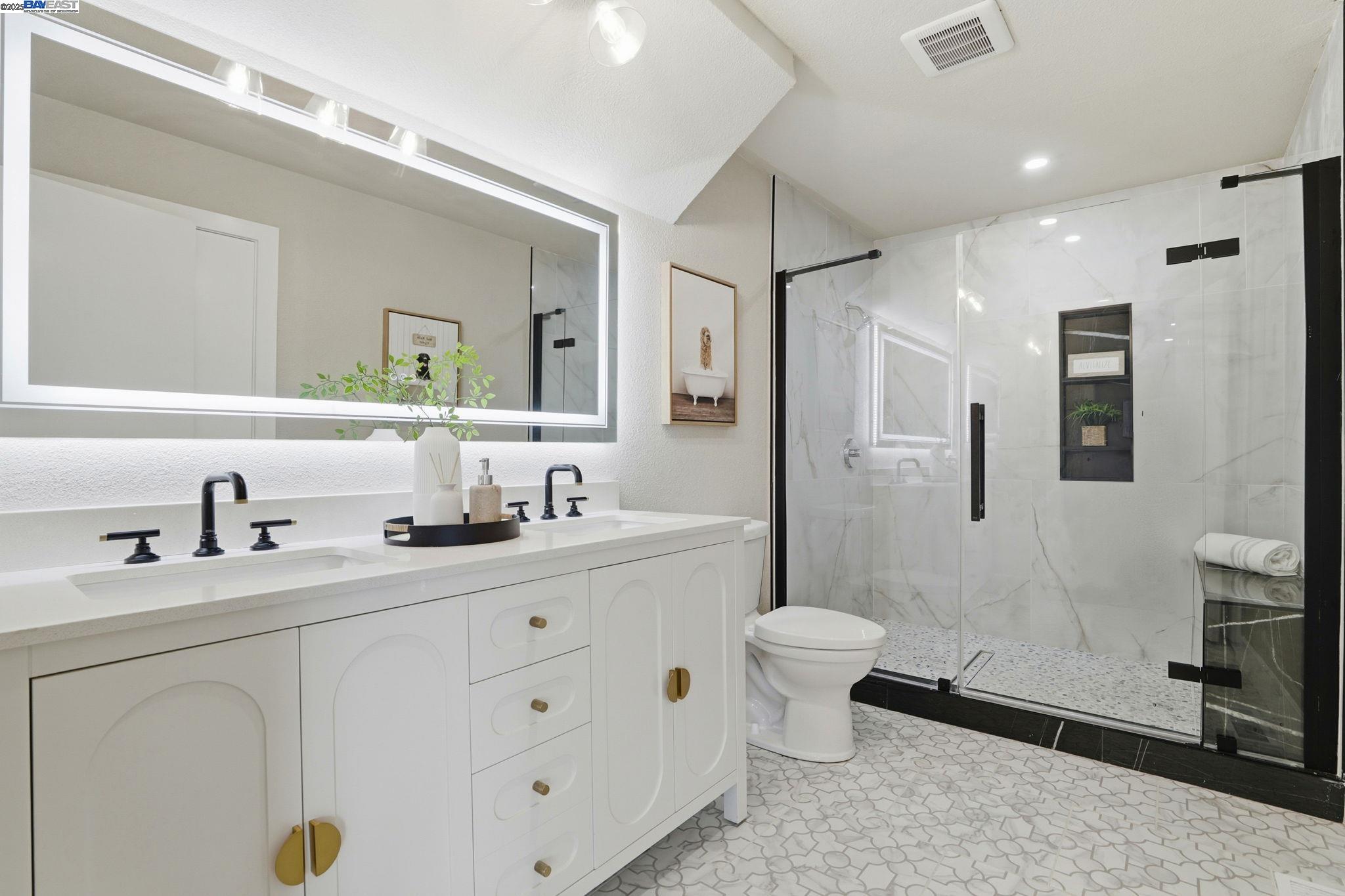 10745 Ridgeview Way San Jose, CA 95127 - Photo 24 of 54 a bathroom with a double vanity sink toilet mirror and shower