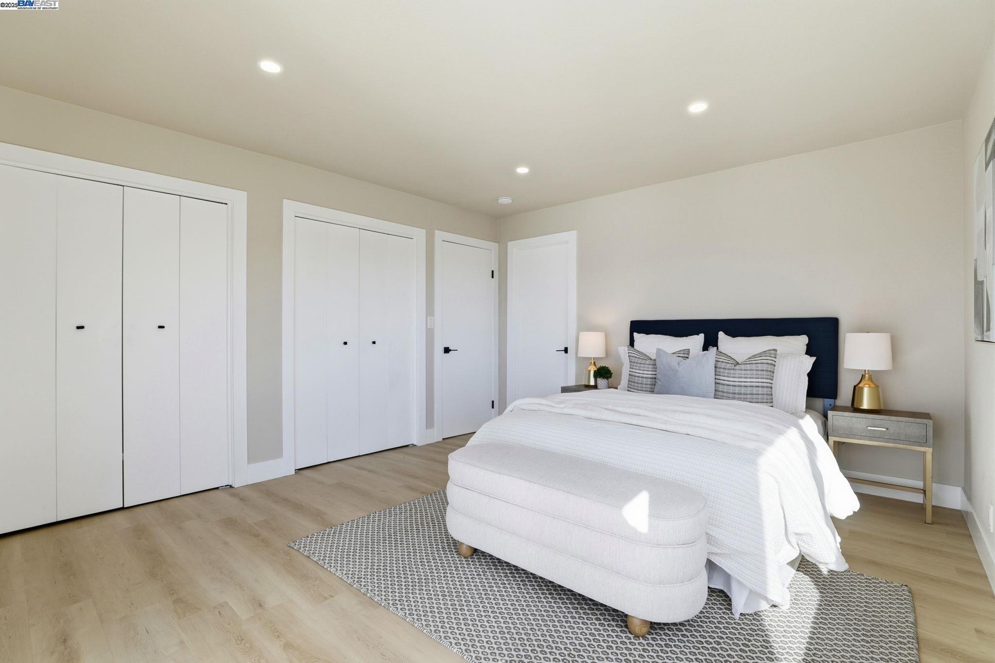 10745 Ridgeview Way San Jose, CA 95127 - Photo 26 of 54 a spacious bedroom with a bed and a potted plant